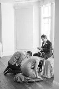 Traditional tea ceremony with the couple kneeling before elders