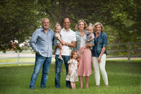 Family of 7 standing in grass at their Detroit Family photography session