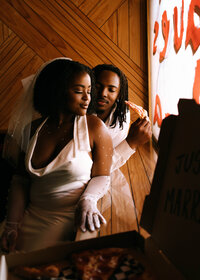 Alabama elopement photographer captures a courthouse elopement couple in a Homewood pizza shop after wedding at the courthouse