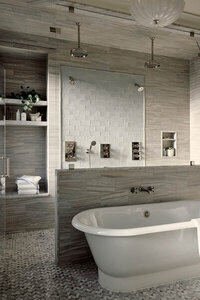 A newly designed primary bathroom with classic details in a traditional brownstone renovation by a Boston interior designer, blending old and new.