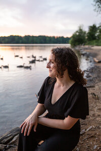 A-female-entrepreneur-poses-at-Loch-Raven-Park-during-sunset-for-a-branding-headshot-with-Ingrid-Berrios.