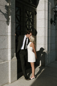 Couple sitting on the ground hugging and smiling