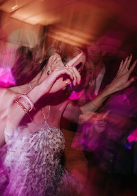 Wedding Couple kissing outside of an iron gate after their wedding.