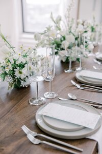 Close up of a tablescape with florals and place settings