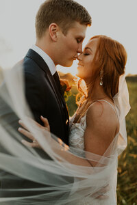 bride and groom kissing