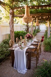 Boho wedding table setting at carnton plantation with flower centerpiece