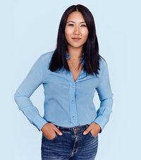 Woman in blue shirt blue background.