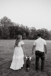 Natural light lifestyle family portraits with kids playing in nature.