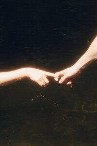 couple having an intimate moment of kissing her shoulder melbourne engagement