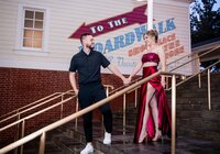 couple walking down stairs in a beautful outfit elegant