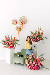 Carmel valley photographer posing with stunning floral arrangements