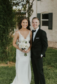 B ride and groom smiling