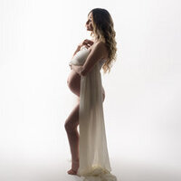 Pregnant woman posing during studio maternity session in Massachusetts