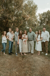 Photo of an extended family session taken by Bailee Freeman Photography at Eagle Park in Rexburg, Idaho.