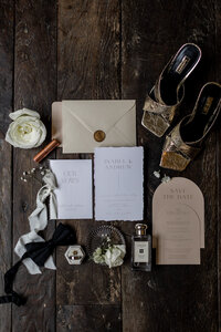 bride and groom posing in front of  tall wooden door