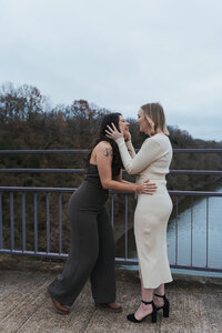 Two women prepare to kiss after saying "I do" at the altar of their Nashville elopement