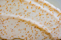 Close up of a lotion with exfoliating beads in it