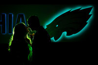 GO Birds! Silhouette of an engaged couple kissing at the Philadelphia Eagles stadium during their session.