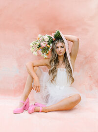 Bride strikes a pose with her wedding bouquet