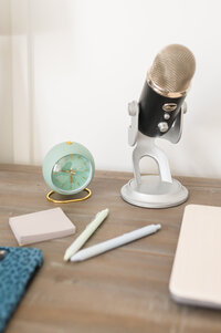 A professional microphone on a podcast setup, representing the Sustainable Foundations Podcast — a show for faith-led women building sustainable businesses with strategy, stewardship, and a whole lot of Jesus.
