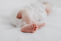 Close up of a newborns foot. whilst being photographed in the studio. Newborn photographer based in Surrey