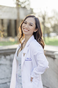 Headshot of a beautiful doctor in front of the Detroit Institute of Arts