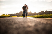 Luxury Portraits by Moving Mountains Photography in NC - Photo of a couple walking down the road