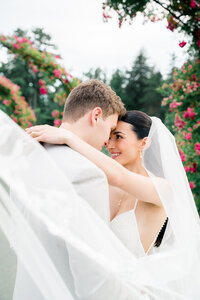 Newport Wedding Photographer | Rhode Island Caprio Captured Photography | Couple standing close together with a stunning table setting in the background