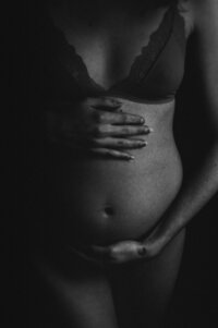 Elegant maternity portrait taken in the Twin Cities, highlighting the grace and anticipation of motherhood with timeless photography.