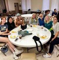 group of medical students sitting around table