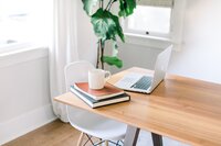 Modern desk flatlay with potted plant