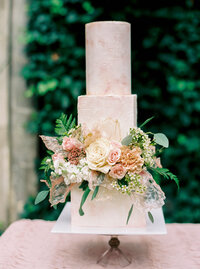 Stunning modern wedding cake with floral accents