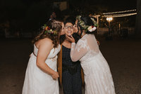 bride kissing friend