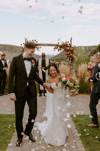 Some of the most elegant bridal details from the couples beach wedding in Cancun, Mexico. The bride incorporated her white shoes, perfume, wedding rings, and earrings for the photos.