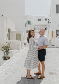 A couple in Greece posing together on the streets 