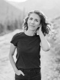 Amanda Mirabella in a black tee shirt on a hike in Colorado