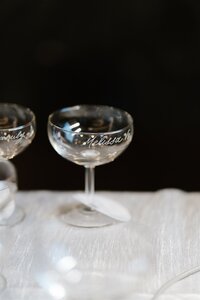 Close up of a coupe glass after hand engraving