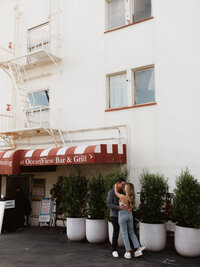 couple slow dancing in a parking lot