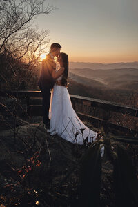 Elopement couple embracing during a sunset in the mountains