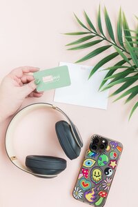 flat lay showing an iPhone and headphones