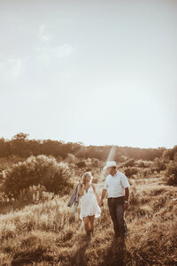 walking down the hillside in texas holding hands