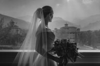 A Broadmoor Bride Looks Out the Window at the Lovely View