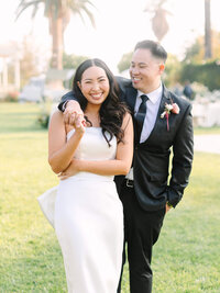 candid photography of bride and groom laughing during cocktail hour