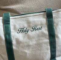 A crochet beg with lemons in it. 