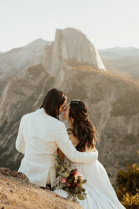 bride and groom kiss in desert