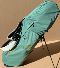 Water resistant golf bag cover by Over Armor Golf standing on golf course