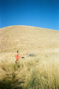Jaiden sitting on chair and taking a selfie
