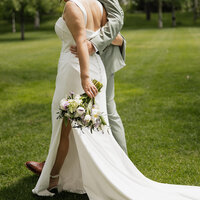 An elegant wedding bouquet featuring lush florals in a modern yet classic design. Perfectly styled for a luxury destination wedding, photographed with an artistic eye