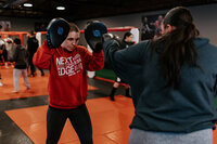 A boxing class in a gym