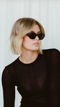 Editorial photograph of a blond model wearing Butterscotch  St Tropez Vieux Sunglasses